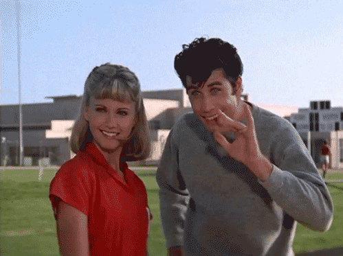 Danny from the movie Grease waving goodbye. 
