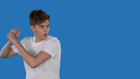 Young white male gesturing hitting a baseball