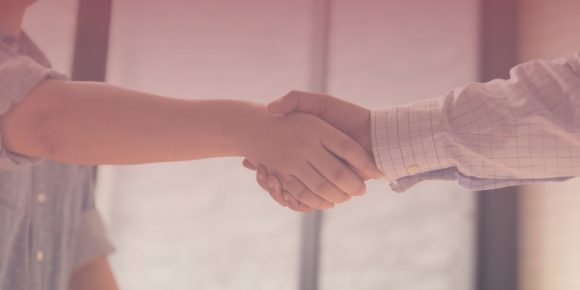 Two business people shaking hands
