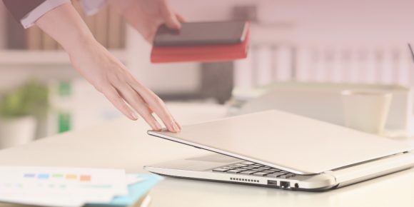 Woman shutting laptop concept of taking time back while working remotely