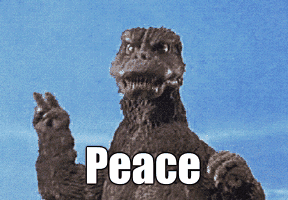 Godzilla saying peace while throwing up the peace sign. 